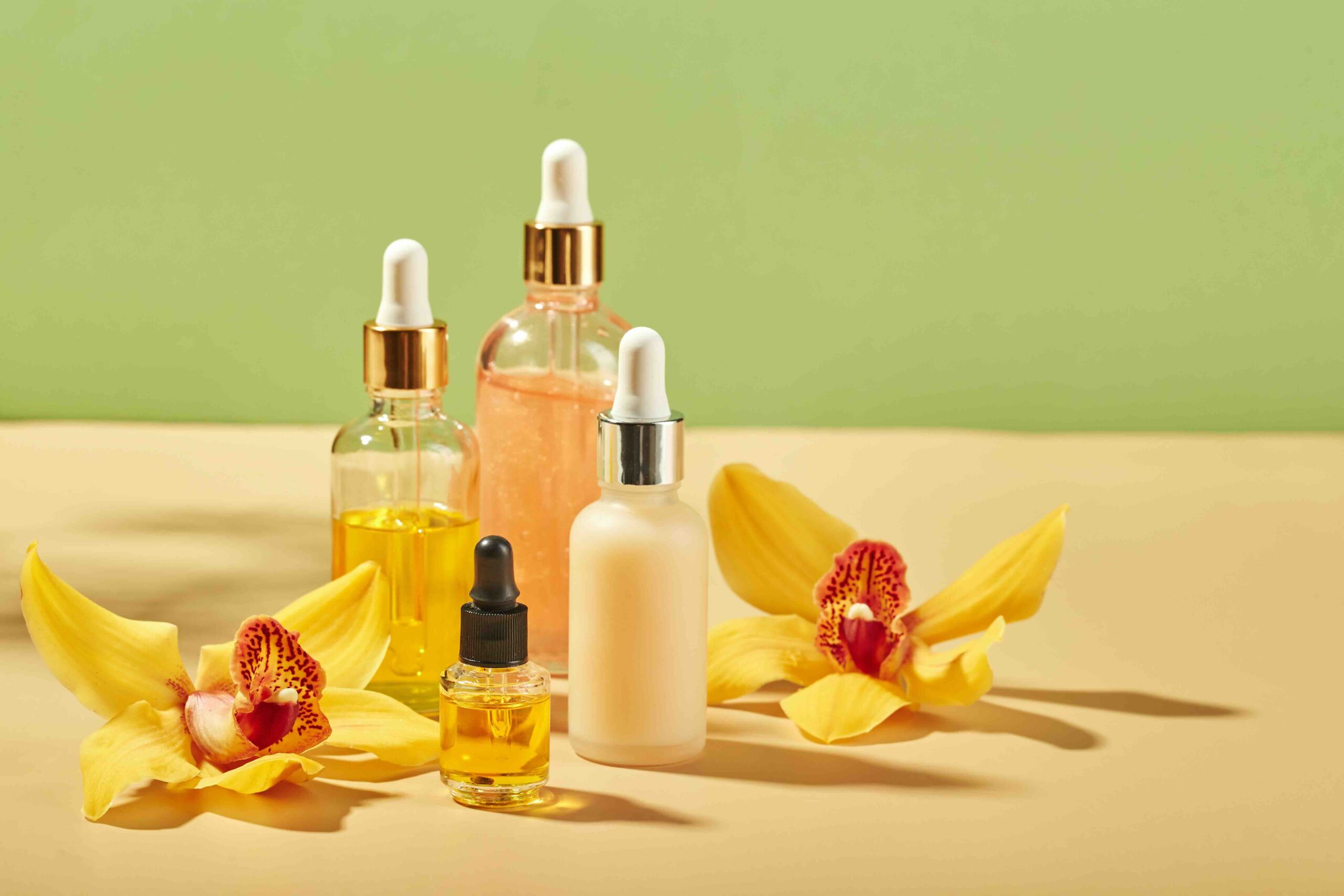 Cosmetic care products in glass bottles with orchid flowers – serums, cream, gel, oils. Concept for face and body care, wellness and spa, tropical relaxation. Frequently Asked Questions about BASF Aroma Chemicals