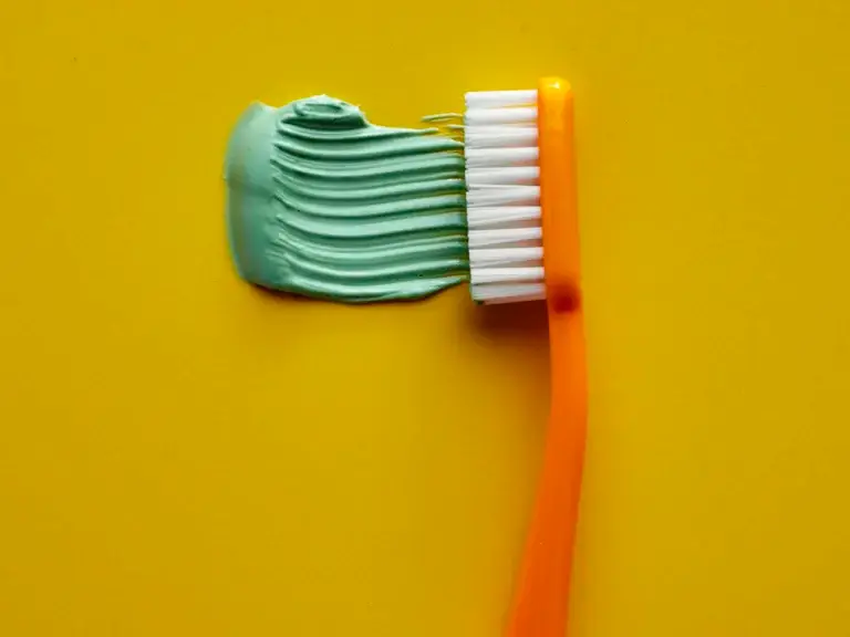 Mint toothpaste on a toothbrush – oral care and dental ingredients such as menthol, eugenol and thymol