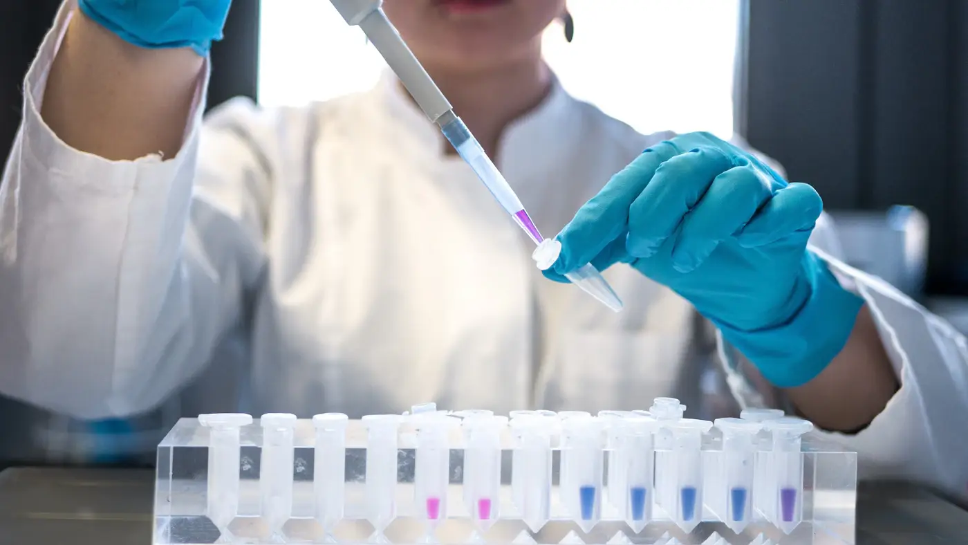 Scientist pipetting lab samples – pharmaceutical ingredient product enquiry